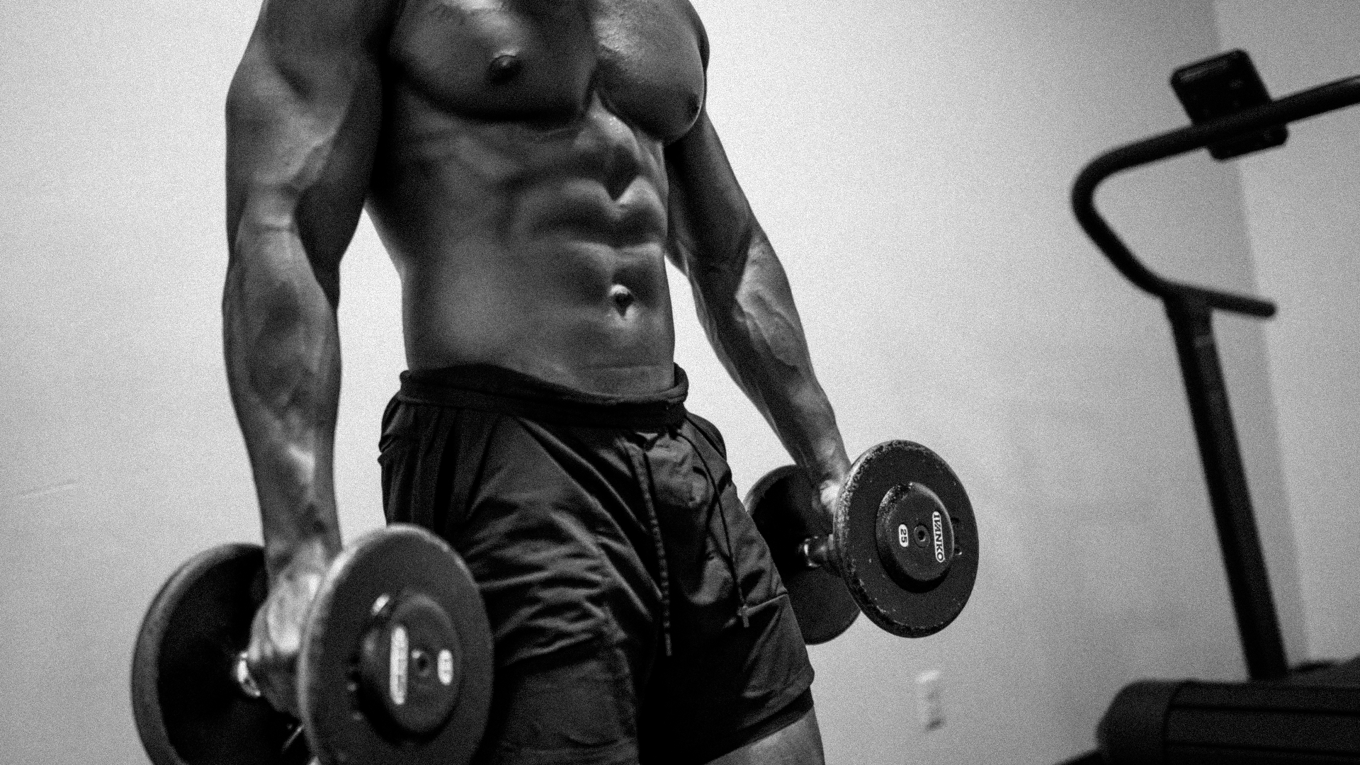 Athlete training under dramatic side light